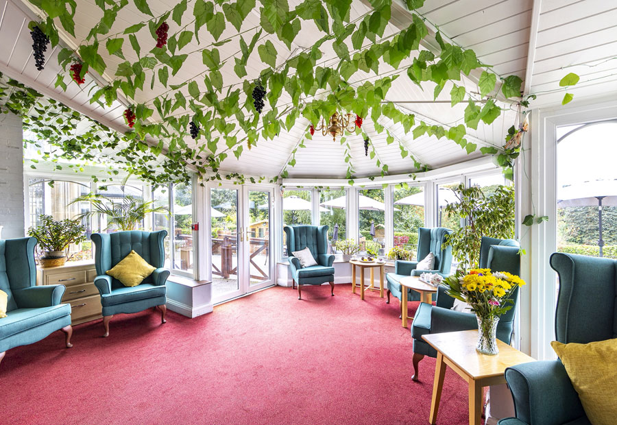 Best Care Home In Surrey - Conservatory Seating Area